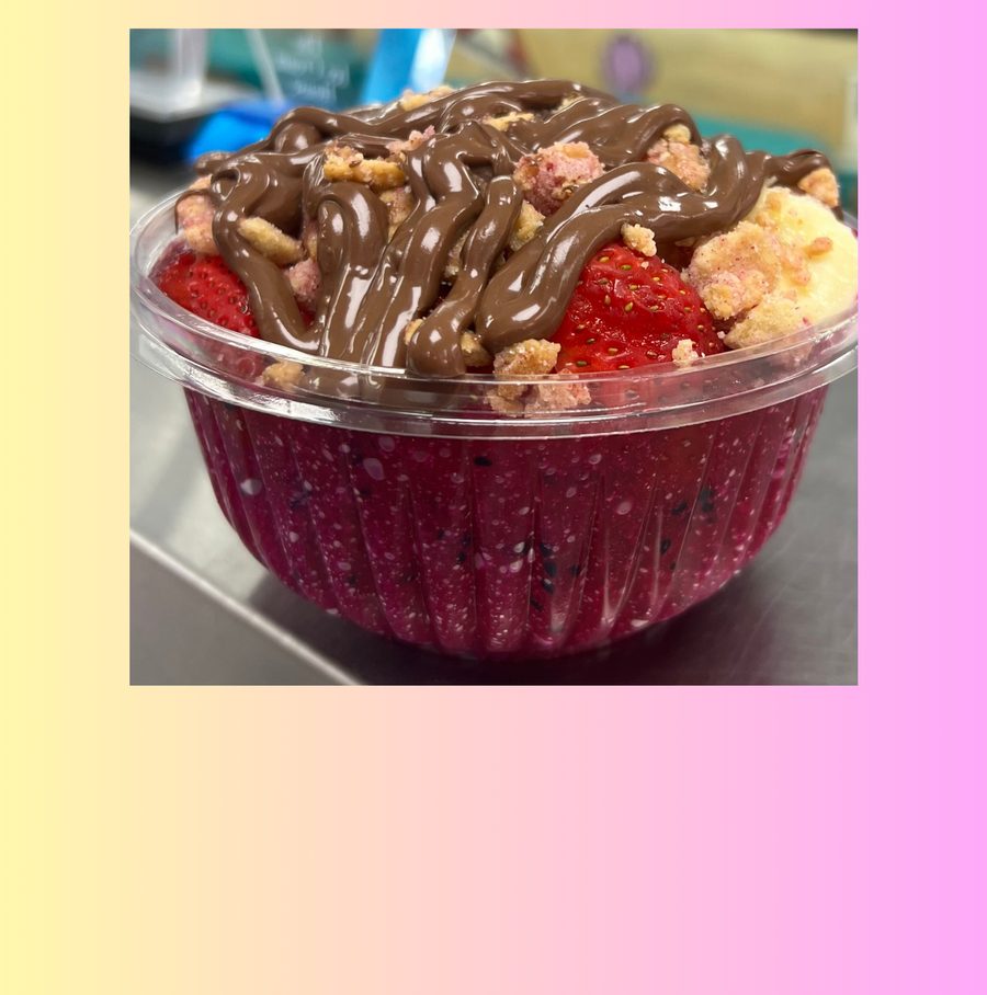 Açaí bowl topped with Nutella, strawberries and granola